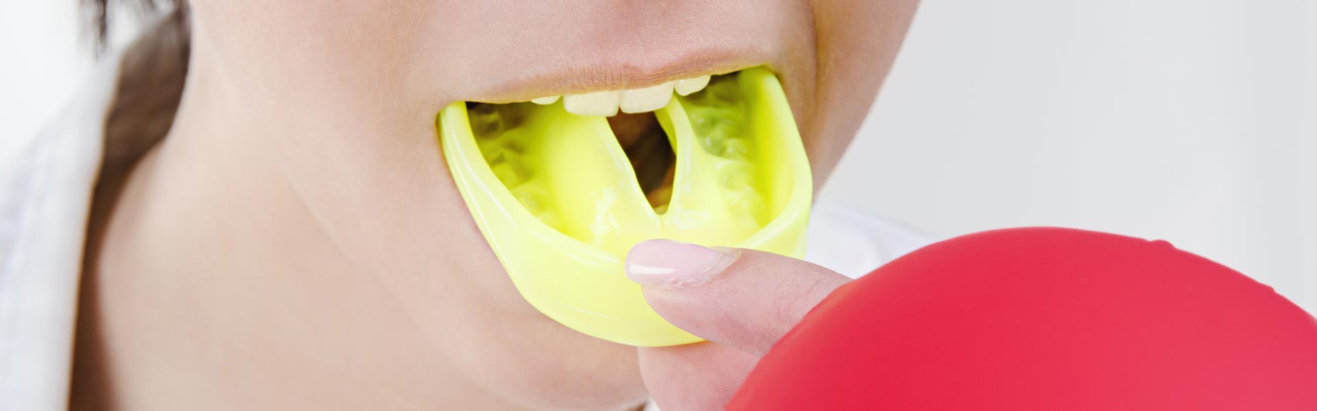A girl wearing sport mouth guards